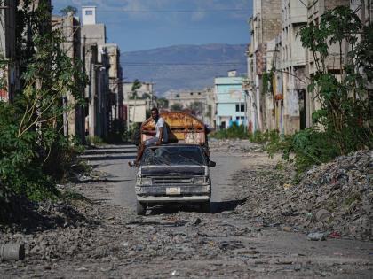 A local travels on public transportation through a gang-controlled area of Port-au-Prince, Haiti, Monday, January 19, 2026.