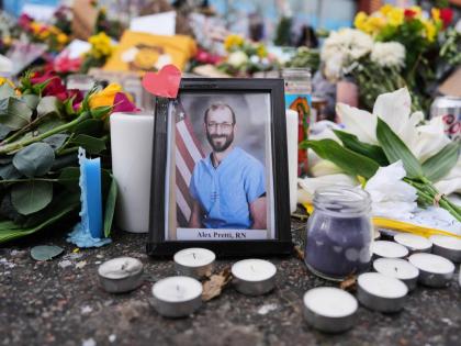 
A photo of 37-year-old Alex Pretti, who was fatally shot by a US Border Patrol officer, is displayed at the shooting scene in Minneapolis.