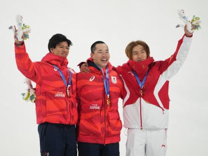 AP 
From left: Silver medallist Japan’s Ryoma Kimata, gold medallist Japan’s Kira Kimura, and bronze medallist China’s Su Yiming celebrate after the men’s snowboarding big air finals at the 2026 Winter Olympics, in Livigno, Italy, yesterday.