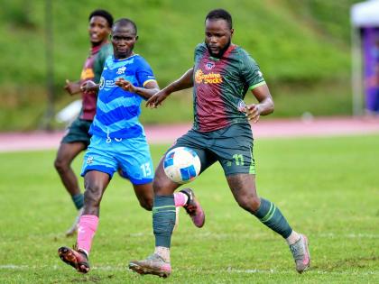 Jourdain Fletcher (right) of Montego Bay United FC prepares to shoot, while Michael Odupe of Molynes United FC looks on during the Jamaica Premier League football match at Stadium East in Kingston on Sunday, October 12, 2025. Fletcher scored twice as MoBay