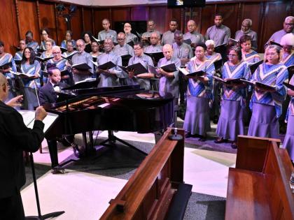 Winston Ewart (front), NCOJ director, during the Chorale’s season-opening concert at the UWI Chapel, Mona, Kingston on Sunday.