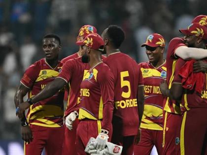 West Indies players celebrate a win over England in their second Group C ICC T20 World Cup cricket game at the Wankhede Stadium in Mumbai, India on February 11.