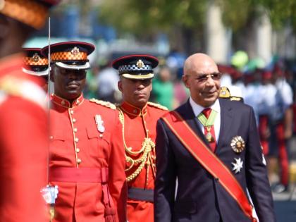 Governor General Sir Patrick Allen inspects the Guard of Honour mounted by members of the Jamaica Defence Force during the ceremonial opening of Parliament on Duke Street in downtown Kingston in 2023.