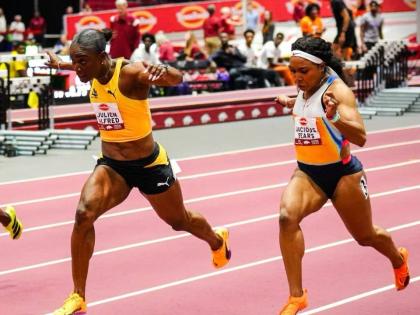 
St Lucia’s Julien Alfred outdips the United States Jacious Spears during the Tyson Invitational at the Randal Tyson Track Center in Fayetteville on Friday, February, 13, 2026.
