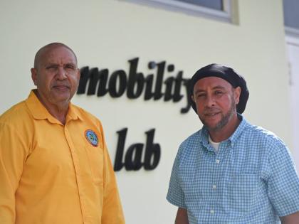 Belizean Eric Vernon (left),  an automotive instructor employed to the Institute for Technical and Vocational Education and Training and Kittian Nicholson Webster, chief foreman mechanic at the Public Works Department in the MInistry of Infrastructure,