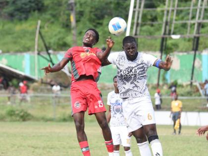Montego Bay United’s Nashordo Gibbs (left) and Cavalier FC’s Jeovanni Laing battle for the ball during their Jamaica Premier League game at Jarrett Park in Montego Bay yesterday.