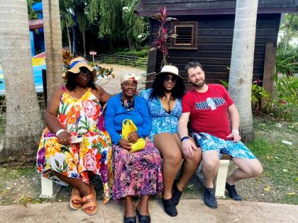 Centenarian Wedie May Howell (second left) surrounded by friends and family.