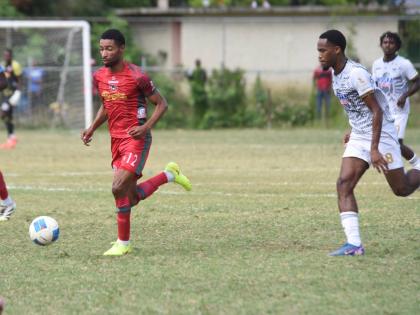 
Montego Bay United’s Timar Lewis (left) dribbles away from Cavalier SC’s Adrian Reid during a Jamaica Premier League football game at Jarrett Park in Montego Bay last Sunday.