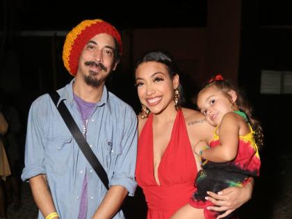 Shiah Coore, his sister Ashley Coore and Ashley’s daughter, Kailani, pose for a family snap as they honour their patriarch Stephen ‘Cat’ Coore.