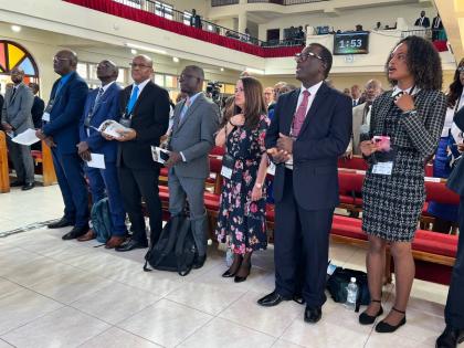 Gabrielle Morrison (right) sings the theme song with other local and regional leaders of the Seventh-day Adventist Church.