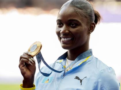 Julien Alfred of St Lucia displays the gold medal she won at the 2024 Paris Olympic Games.