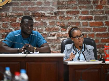 Councillor for the Oracabessa Division in St Mary, Ramon Henry (left), chairs the Public Health and Sanitation Meeting of the St Mary Municipal Corporation on February 24. At right is Chief Executive Officer, Ethlyn Douglas.