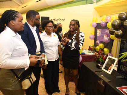 From left: Rochelle Daley, resident advisor at Rex Nettleford Hall; Michael Mullings, keynote speaker and CEO of Chatflow; Sandrene McKenzie, CEO of San’script; and Khalia King, owner of Elethia Creative, in dialogue at Rex Nettleford Hall’s business e