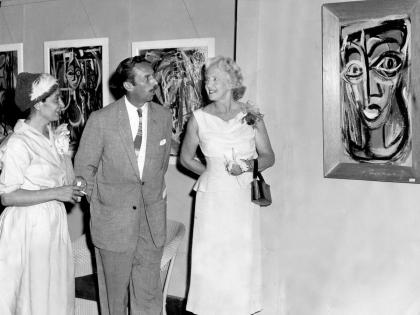In this 1959 photo (from left) artist Vicki Noonan is seen discussing some of her work with her husband, Tom Noonan and Mrs. Edna Manley, who opened the exhibition at Art Gallery of the Institute of Jamaica.