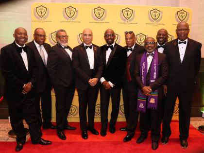 Jamaica’s Ambassador to the United States, Major General (Ret’d) Antony Anderson (centre) shares the spotlight with members of the David ‘Wagga Hunt’ Gala organising committee at its 12th annual red carpet gala at the National Education Association