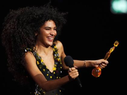 Olivia Dean wins the Pop Act Award during the Brit Awards 2026 in Manchester, England, on Saturday.