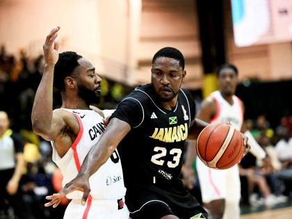 Canada’s Aaron Best stays close to Jamaica’s Tyran De Lattibeaudiere in action from the FIBA World Cup basketball qualifier at the National Indoor Sports Centre last night. Canada won 97-81.