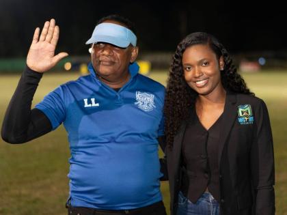 St Thomas FA President Lascelles Logan gives a high five, representing the announcement of a $5.1m sponsorship, courtesy of McKay Security, to the parish’s football. Logan is joined by McKay Security’s Jessica Jackson at Ash Wednesday’s launch of the