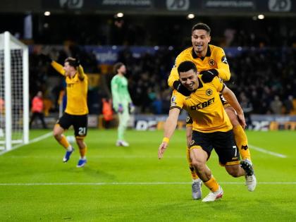 Wolverhampton Wanderers' Andre, front right, celebrates after scoring their second goal of the game during an English Premier League match against Liverpool, Tuesday, March 3, 2026, in Wolverhampton, England. (Nick Potts/PA via AP)