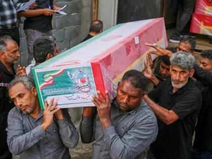 A coffin is carried during the funeral of mostly children killed in what Iranian officials said was an Israeli-US strike February 28 at a girls’ elementary school in Minab, Iran.