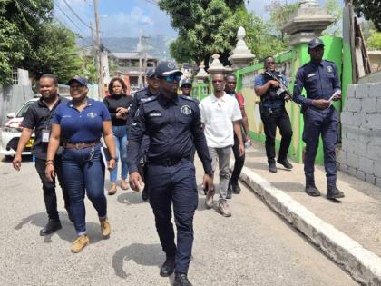 Members of the St Andrew North Police Division and other stakeholders on a community walkthrough in Grants Pen, St Andrew on March 6.