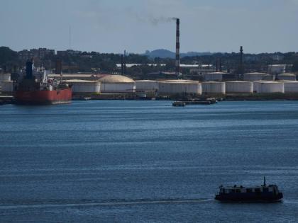A ferry crosses Havana Bay past the Nico Lopez oil refinery where a Cuban tanker is anchored in Havana, Cuba, Thursday, February 26, 2026. 