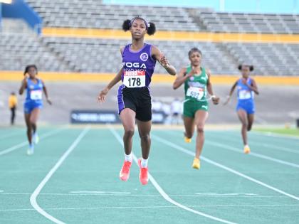 Photos by Gladstone Taylor/Multimedia Photo editor 
Foga Road’s Shameika McLean runs away with the under-17 girls’ 400 metres at the Carifta Trials inside the National Stadium yesterday.