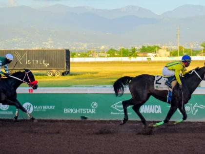 Anthony Minott/Freelance Photographer  
NEO STAR (right), ridden by Tajay Suckoo, wins the second running of the nine-furlongs-and 25-yard International Women’s Day Trophy ahead of  DON KWESI at Caymanas Park yesterday.