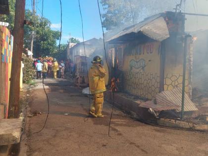 Firefighters at the scene of a fire in Craig Town, St Andrew on March 8, 2026.