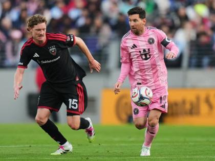 Inter Miami forward Lionel Messi (right) advances past DC United defender Kye Rowles (15) during the first half of an MLS soccer match, Saturday, March 7, 2026, in Baltimore. 