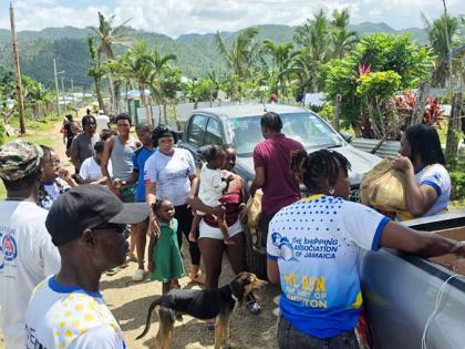 Members of the Shipping Association’s team distributing relief packages to residents in Goldsmith, Westmoreland.