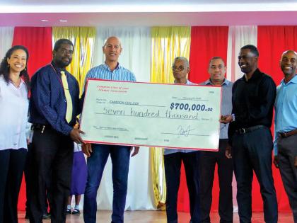Campion College principal Dr Lavare Henry (second left) and master chemistry teacher Radley Reid (fourth right) with alumni Rita Coore‑Widener (left), Zachary Harding (third left), Dennis Oliver (third right), Richard Grey (second right) and Dave Garcia 