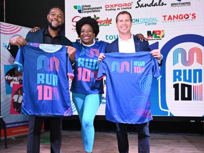 From left: Richard Vernon, the mayor of Montego Bay; Janet Silvera, chairperson of the Jill Stewart MoBay City Run (JSMCR); and Adam Stewart, executive chairman of Sandals Resorts International, display jerseys to be worn by participants in the annual even