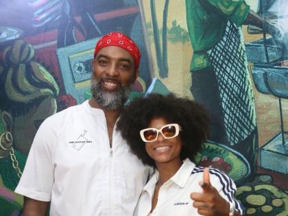 Chef Scotley Innis (left) poses with reggae star Lila Iké.