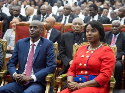 Haiti's President Jovenel Moise sits with his wife Martine during his swearing-in ceremony at Parliament in Port-au-Prince, Haiti, Tuesday February 7, 2017.  (AP Photo/Dieu Nalio Chery, File)