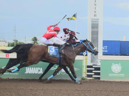 
FUNCAANDUN (right), ridden by Robert Halledeen, wins the Alexander Hamilton Memorial Trophy ahead of SUPER NATURAL POWER (Raddesh Roman) over seven furlongs at Caymanas Park yesterday.
