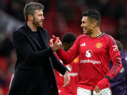 Manchester United's coach Michael Carrick (left) and Casemiro walk off the pitch after the Premier League match between Manchester United and Aston Villa in Manchester, England yesterday.