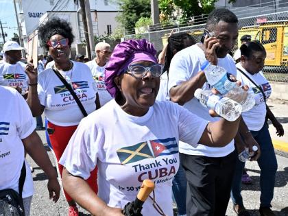 Supporters participate in the Gratitude Walk from Hanover Street to Heroes Circle in Kingston yesterday, showing appreciation to Cuban medical professionals for their 50 years of medical support to the Jamaican people.