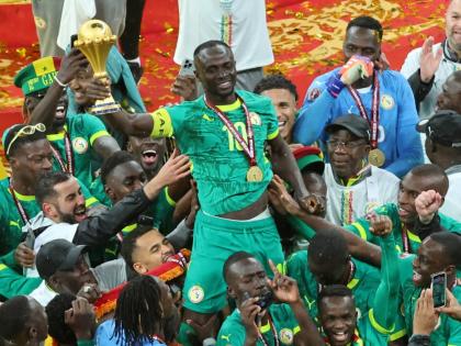 Senegal's Sadio Mane holds the trophy aloft as he celebrates with teammates after winning the Africa Cup of Nations final football match between Senegal and Morocco in Rabat, Morocco, Sunday, January 18, 2026. (AP Photo/Youssef Loulidi, File)