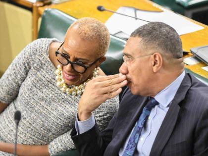 Prime Minister Dr Andrew Holness in dialogue with Fayval Williams, minister of finance and the public service, during Opposition Leader Mark Golding’s (not pictured) 2026-2027 Budget Debate presentation in the House of Representatives on Tuesday. 