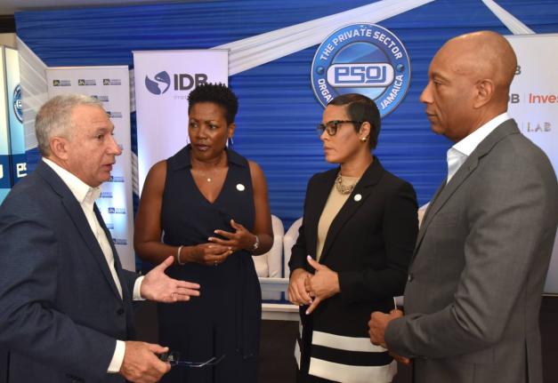 President of the Private Sector Organisation of Jamaica (PSOJ), Metry Seaga (left), converses with from (second left) Executive Director of the PSOJ, Sacha Vaccianna-Riley; Deputy Managing Director, Jamaica National (JN) Bank, Gillian Hyde, and Managing Di