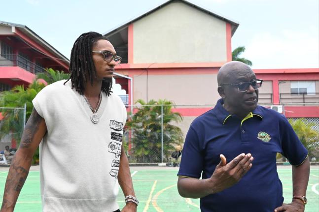 
San Antonio Spurs Devin Vassell (left) and JaBA President Paulton Gordon.