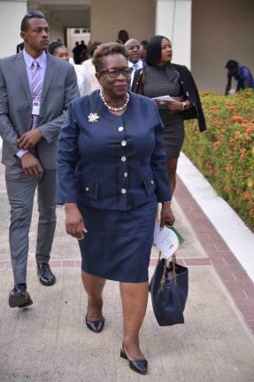 Outgoing Director of Public Prosecutiona Paula Llewellyn arriving at yesterday’s swearing-in ceremony Prime Minister Dr Andrew Holness on the lawns of King’s House. 