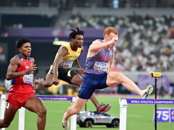 Roshawn Clarke (centre) competes in the men's 400m hurdles race at the Tokyo World Athletics Championships.