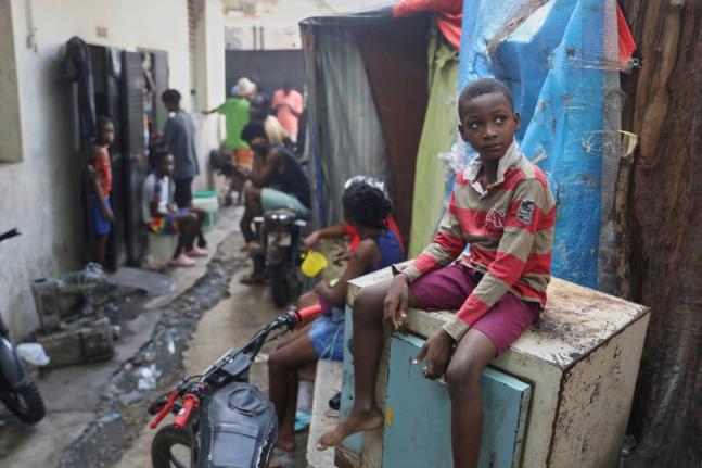 People displaced by gang violence live at the Ministry of Public Works, Transport and Communications office converted into a shelter in Port-au-Prince, Haiti.