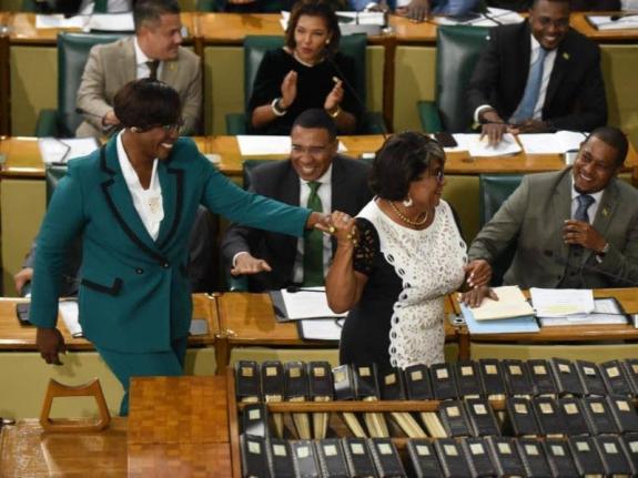 Juliet Holness (left) was escorted to take the Oath of Office by former House Speaker Marisa Dalrymple-Philibert after she was elected as Speaker of the House of Representatives.