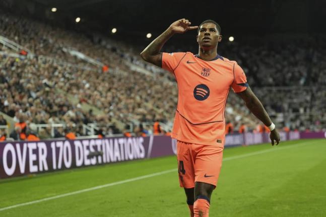 Barcelona’s Marcus Rashford celebrates after scoring his team’s second goal during the Champions League, opening phase match between Newcastle and Barcelona in Newcastle, England, yesterday.