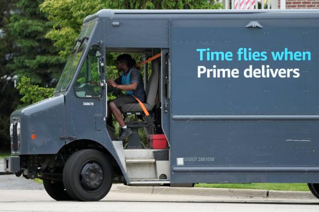 FILE - An Amazon truck makes deliveries in Wheeling, Illinois, May 16, 2024. (AP Photo/Nam Y. Huh, File)