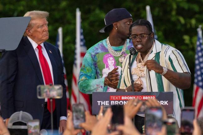 Rapper Sheff G (right), given name Michael Williams, joins then Republican presidential candidate Donald Trump during a campaign rally in the Bronx borough of New York on May 23, 2024.