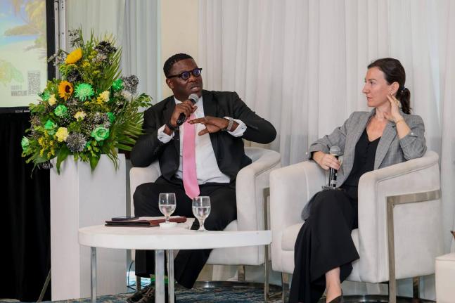 Stephen Price, vice president and general manager, Flow, speaks on Meaningful Connectivity at the Caribbean Telecommunications Union ICT Week at the Jamaica Pegasus hotel on Tuesday September 30. Looking on is Elona Cela, senior investment officer at the I